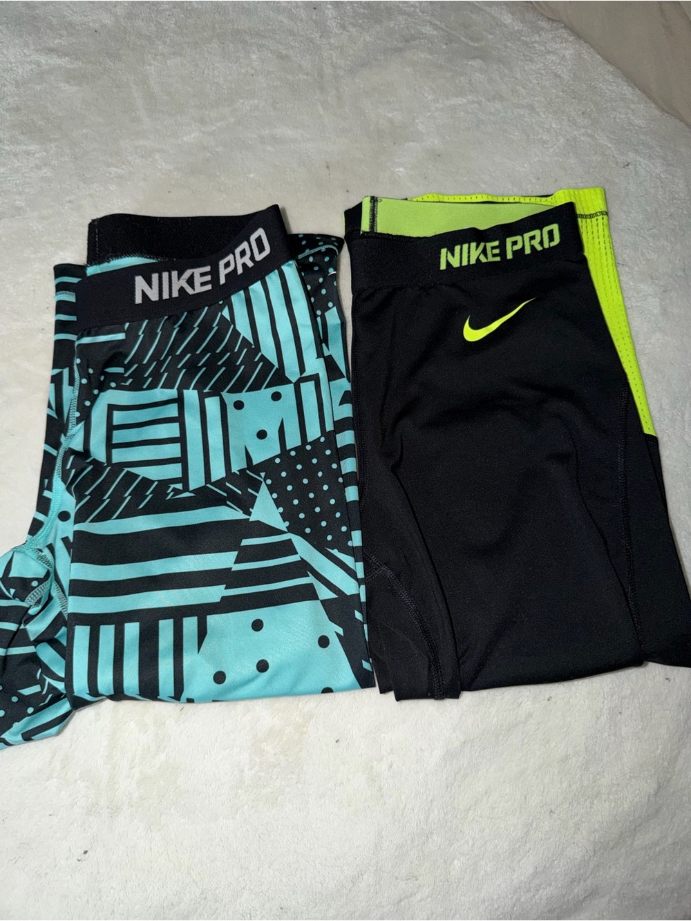 Two pairs of Compression Shorts - Black and yellow & Black and Teal